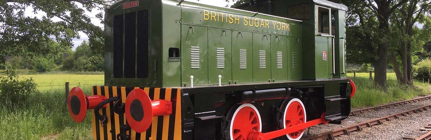 Green train on tracks, British Sugar York