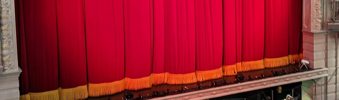 Red theater curtains with gold trim