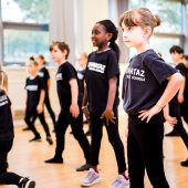 Children in a dance class practicing moves