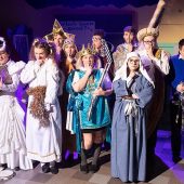 Group of people in costume, looking surprised