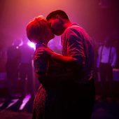 Couple kissing passionately on dance floor