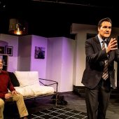 Two actors performing intense stage scene