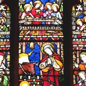 Stained glass nativity scene in vibrant colors