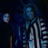 Spooky duo in striped suit and dark room