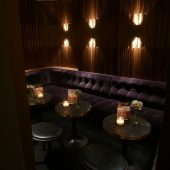 Cozy, dimly lit lounge with candles