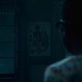 Spooky figure outside window at night