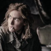 Person smoking indoors, contemplative mood