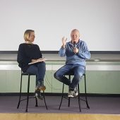 Two people having an on-stage discussion