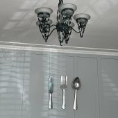 Chandelier and cutlery wall decor