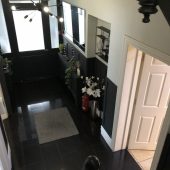 Modern black hallway decor with plants