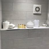 Bathroom shelf with toiletries and towels