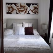Cozy bedroom with floral artwork