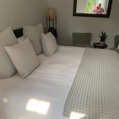 Cozy bedroom with mirror reflection