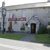 Frampton Arms pub exterior with flags