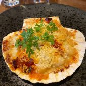 Baked scallop in shell with herbs