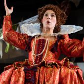 Renaissance actor in ornate red costume