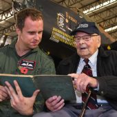 Veteran and pilot reading together